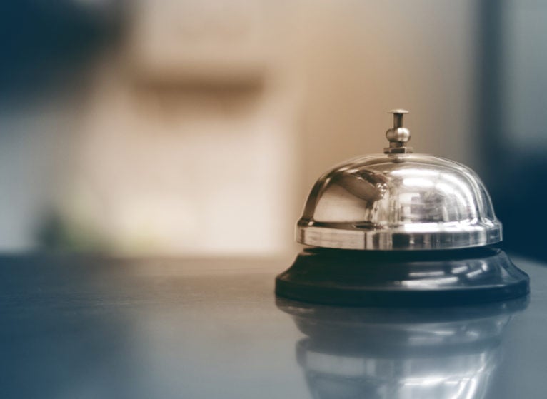 Close-Up Of Service Bell On Table