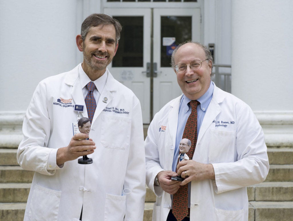 Dr. Costi Sifri and Dr. Mitch Rosner with their bobblehead counterparts.