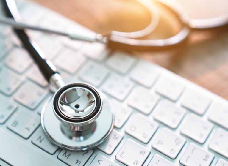 medical stethoscope on keyboard