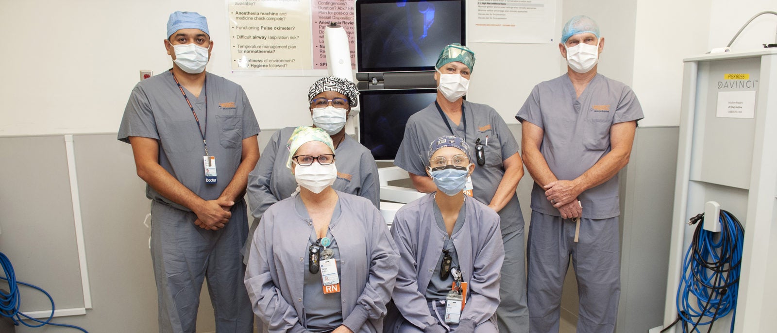 The ION Robot Team with the ION robot: (back, l-r): Subodh Pandey, MD; Kay Browne-Hinds, RN; Deb Moody, RN; Steve Vider, CST; (sitting) Tanya Pultz, RN; and Sara Sharpe, RN