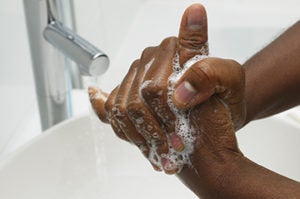 An African American hand washing.  