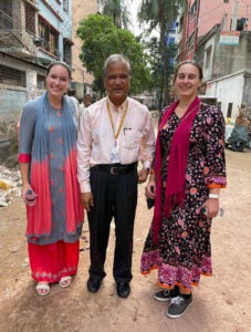 Doctoral students Dana van Fossen and Rachel Boone flank Dr. Rashidul Haque, the principal investigator of the Bangladesh site. (Contributed photo)