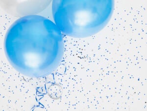 Studio shot of balloons on colored spotted background