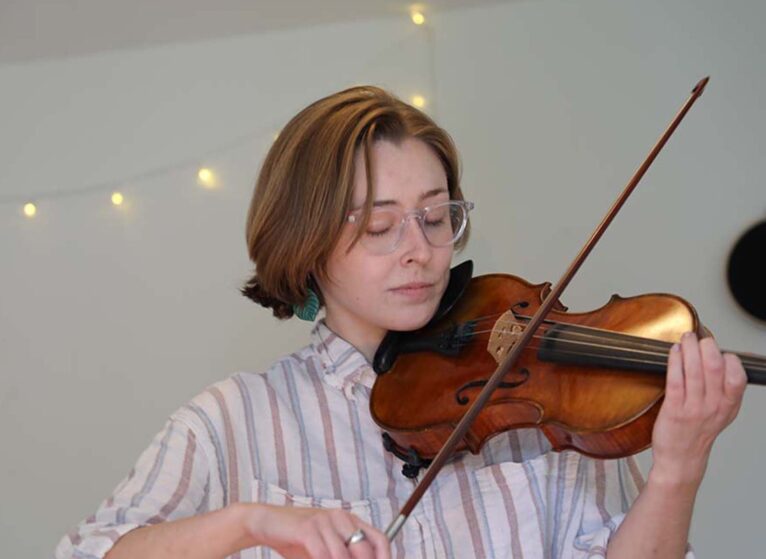 Sarah Russell-Hunter, a lifelong violinist, studied kinesiology, became a CNA, cared for nursing home residents, and hopes to weave music info her care.