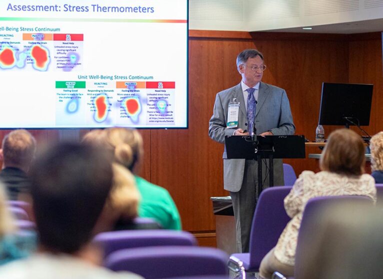 Westphal lectures to a crowd of attendees about the Stress First Aid and peer support approach he pioneered at a 2023 Sigma International Nursing Conference.