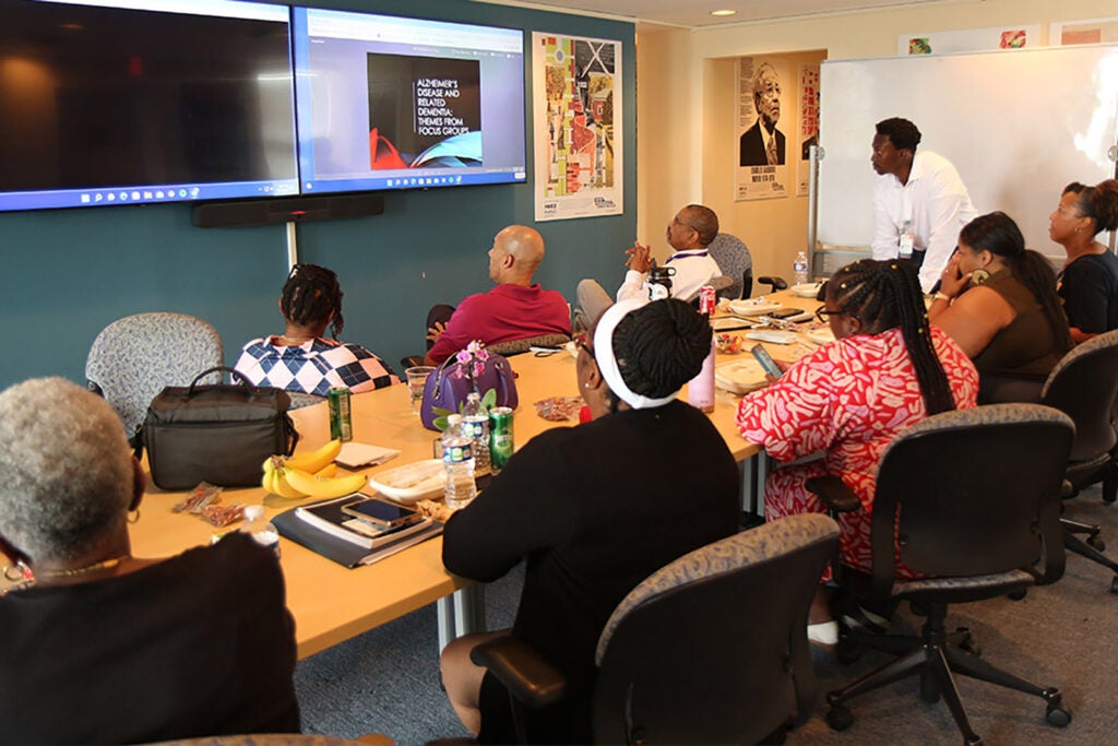 Jones, who often works closely with a Community Advisory Board to inform and further his own work, discusses Alzeimer's disease risk factors with a local group of advisers.