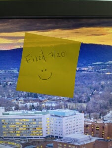 Service with a smile. HIT team members attached smiley face post-it notes to all repaired PCs.