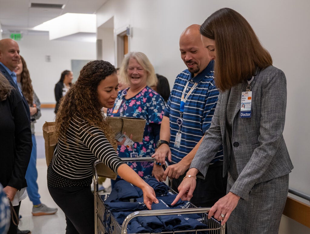 Dean Kibbe on rounds to celebrate UVA Children's ranked #1 children's hospital 4 years in a row.