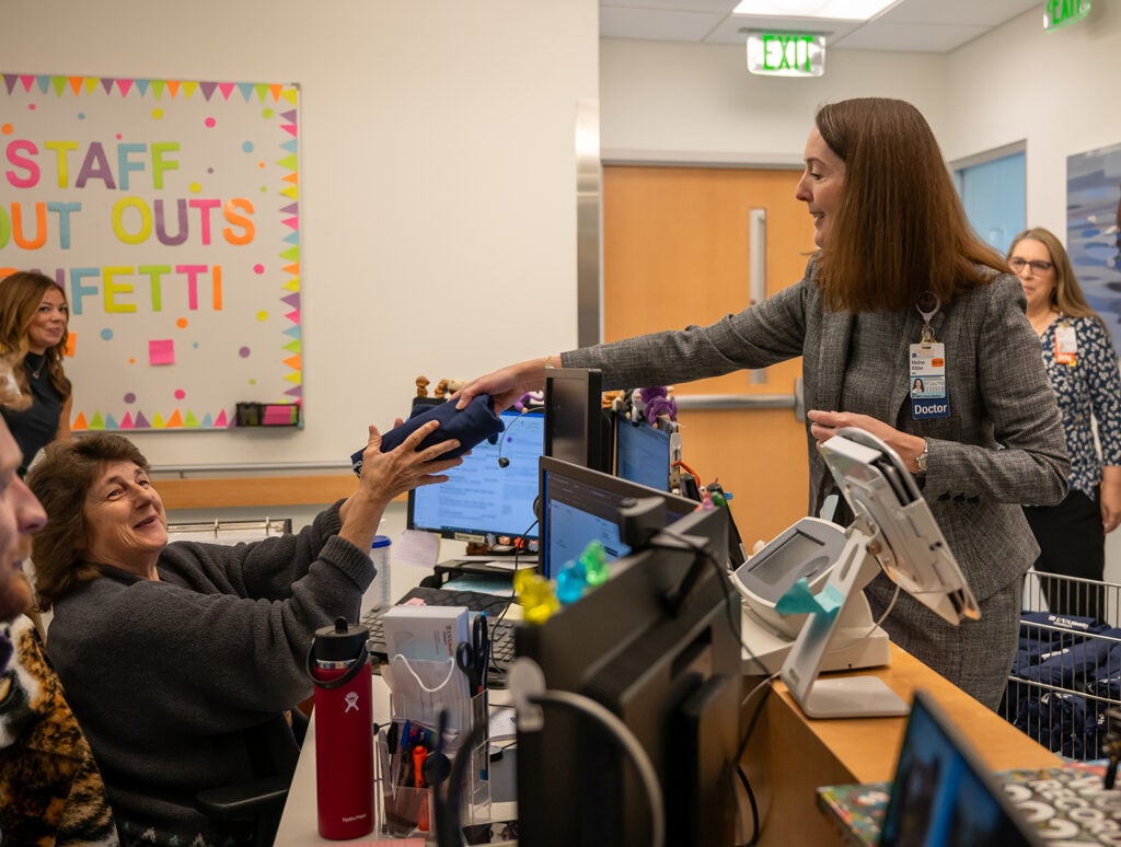 Dean Kibbe on rounds to celebrate UVA Children's ranked #1 children's hospital 4 years in a row.