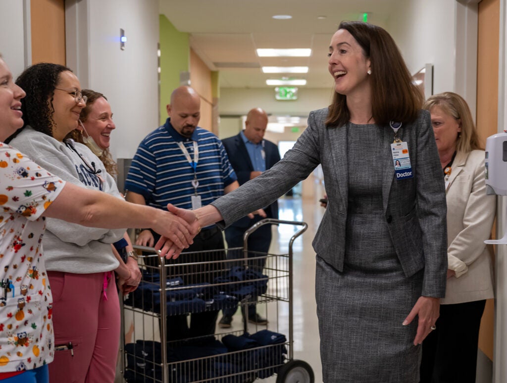 Dean Kibbe on rounds to celebrate UVA Children's ranked #1 children's hospital 4 years in a row.