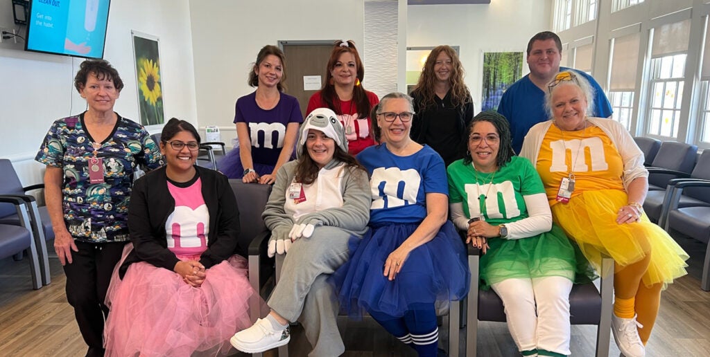 The Access Team and Access Supervisor from UVA Health Primary Care Culpeper wish everyone a Happy Halloween! | Front (l-r): Cathy Printz, Sarah Chauhan, Victoria Graves, Rose Shaffer, Vendetta Mack, and Robin Schools. Back (l-r): Alena Samoilenka, Sharon Lucero, Kimberly Rhinehart, and Caleb Estes.