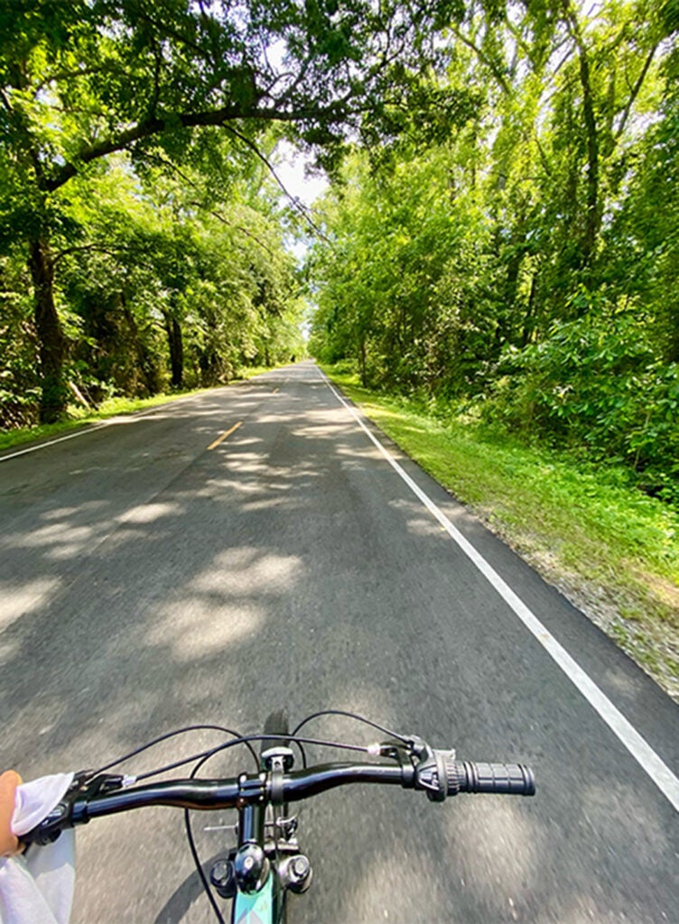 Shaolin riding her bike at the Great Dismal Swamp Canal Trail in Chesapeake, VA.