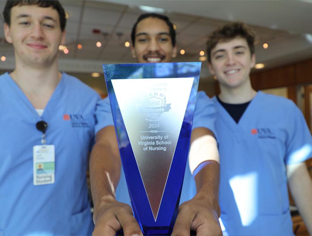 Dennis, Till, and Walker hold the 2024 AAMN Award.