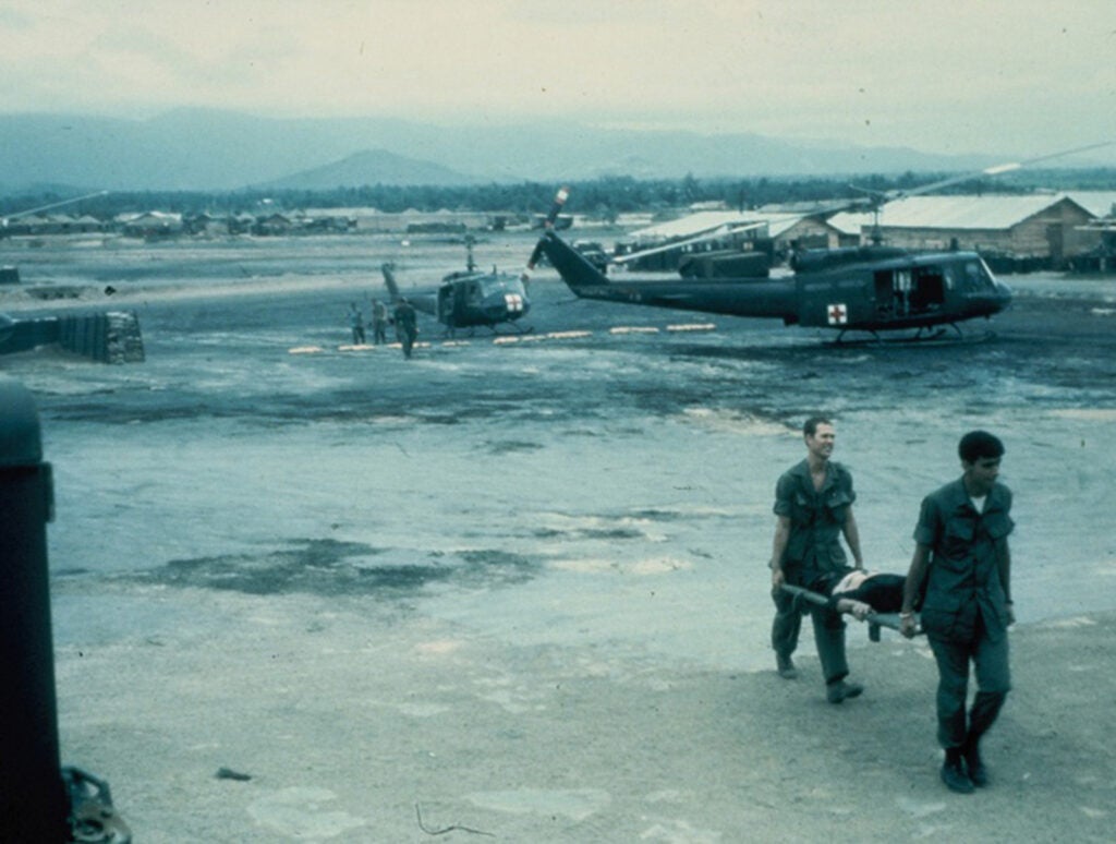 Ferrying wounded soldiers from choppers during the Vietnam War. Dianne M. Gagliano Collection, ECBCNHI.