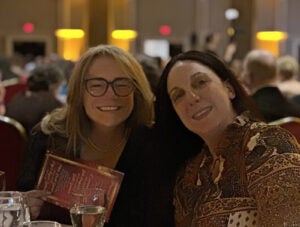 Associate dean Sara Hallowell and Crystal Toll, assistant professor, who earned a Nurse Educator Trailblazer Award, celebrate at the Virginia Nurses Foundation Gala in the fall 2024.