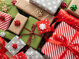 Christmas gift boxes, festive wrapped presents composition. Winter holiday season gifts.