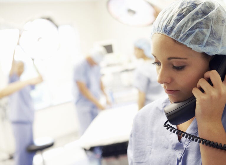 Surgeon Using Telephone