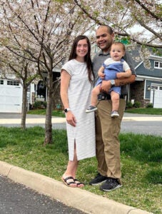 U.S. Army Capt. E.J. Rauch poses with his wife and son outside their home. Rauch’s son was born in the middle of Rauch’s first year at UVA. (Contributed photo)