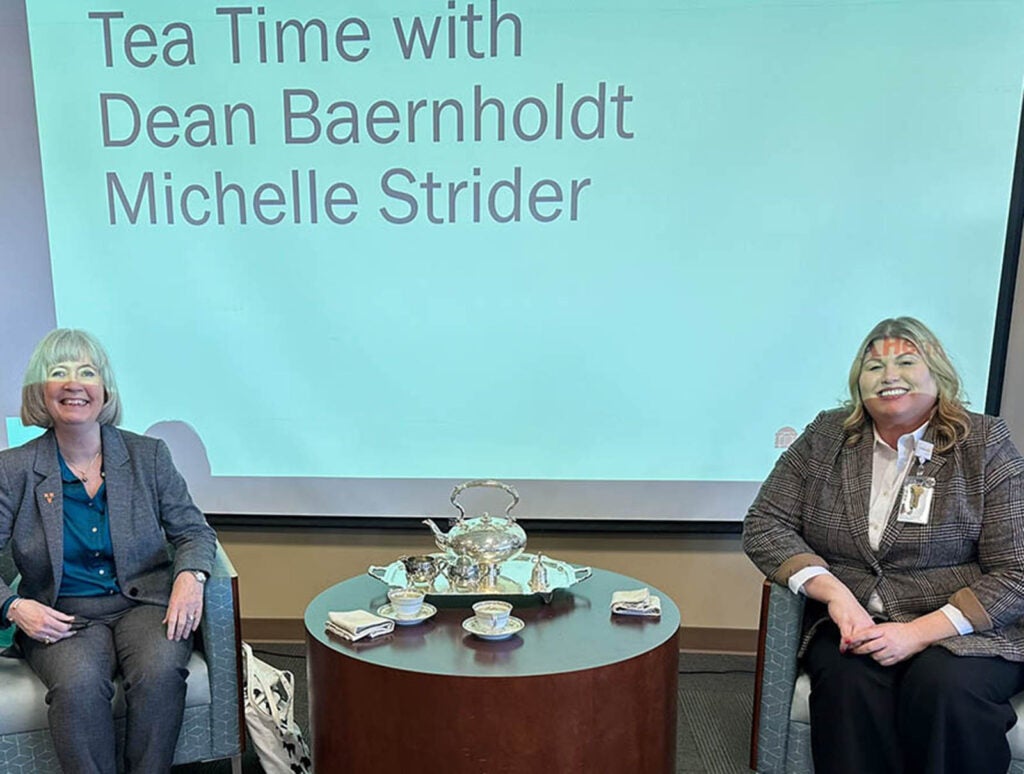 All faculty members - including Dean Baernholdt - raise awareness about the School's programs and needs (seen here with UVA Health chief nurse Michelle Strider and the School's historic tea service).