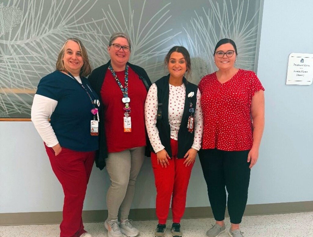 Team members from the Radiation Oncology Clinic at Emily Couric Clinical Cancer Center showing support for “Wear Red Day” 2025: (l-r) Johanna Ellwood, Chrissi Worley,  Baylee Williams, and Lauren Alley.