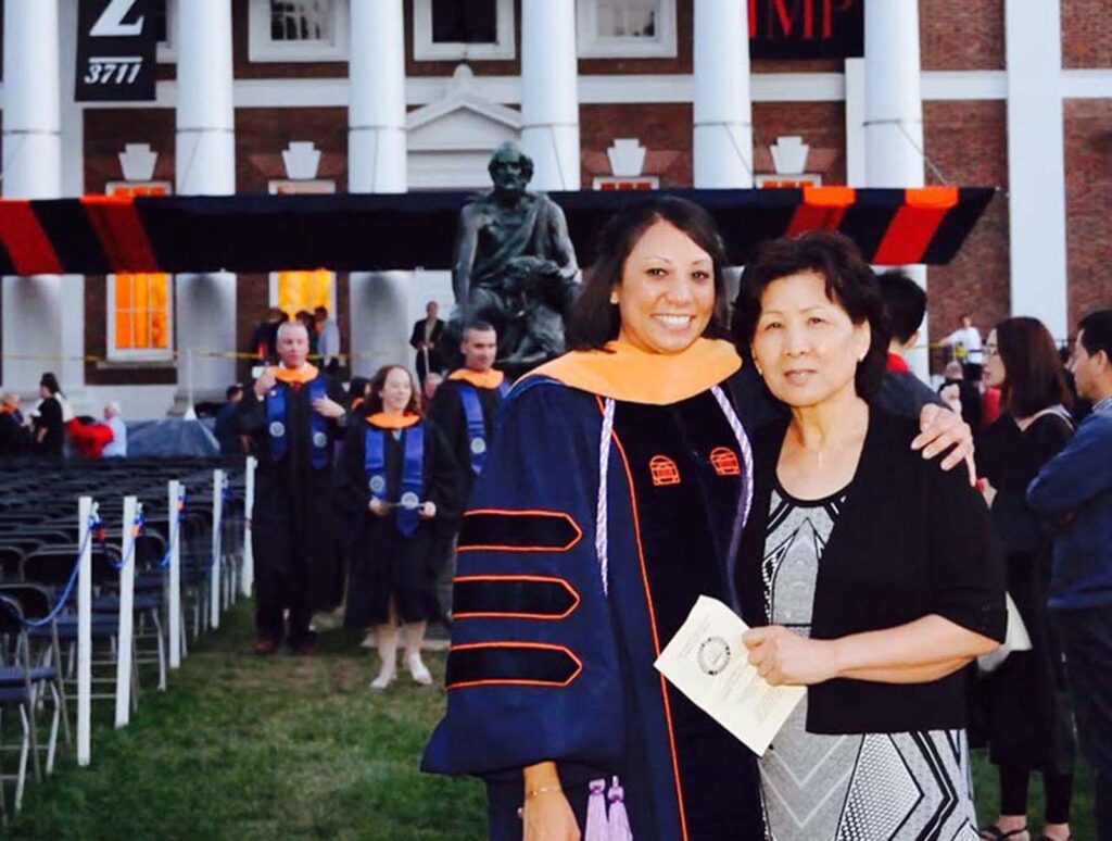 With three UVA degrees to her name (seen here with her mother after earning a DNP from UVA School of Nursing) ...