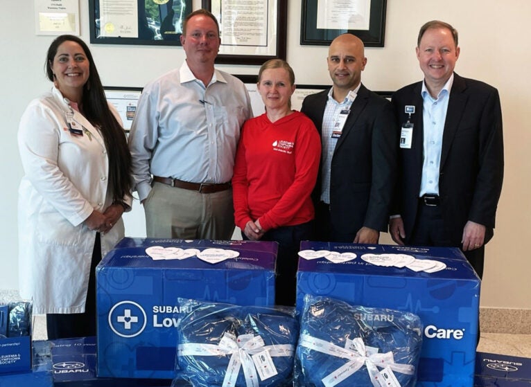 Jessica Harasek, MSN, RN, RN-BC, Acute Care Nurse Manager of Inpatient Oncology and Outpatient Infusion, UVA Health Prince William Medical Center; Drew Hunter, General Manager, Safford Brown Subaru; Emma Whelan, Regional Advancement, The Leukemia & Lymphoma Society; Zan Zaidi, MD, Chief Medical Officer of UVA Health facilities in northern Virginia and Culpeper; and Erik Shannon, Chief Executive Officer, UVA Health facilities in northern Virginia and Culpeper.