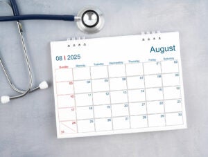 August 2025 calendar and stethoscope