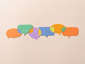 Paper Craft Multi Colored Speech Bubbles Connected With Shared Views on Beige Background Directly Above View.