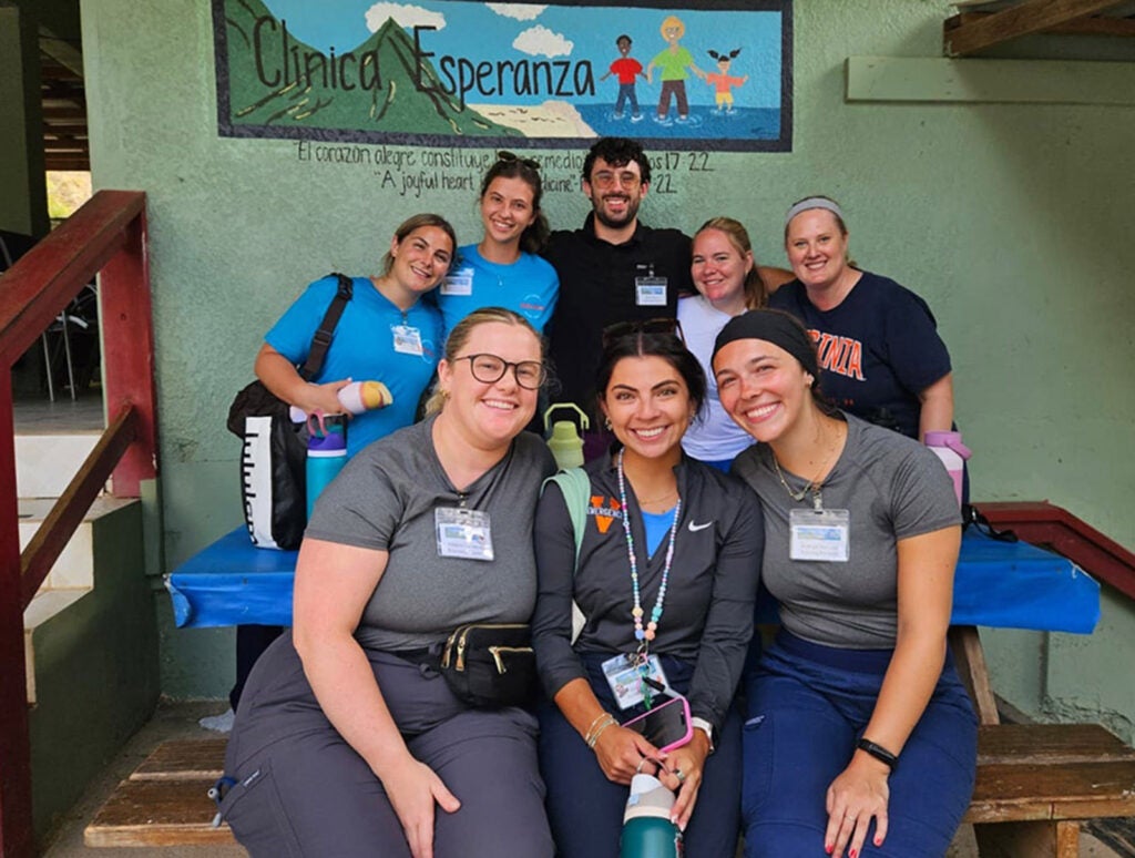 Seven CNL students, including Lexis and Claire (front row, left and center), traveled to Roatan, Honduras in July 2025 with faculty member Katy Hall to earn (each) 56 community health clinical hours.
