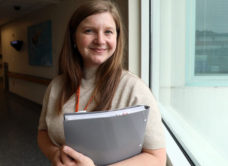 Long, now a nurse practitioner at UVA Health University Medical Center's acute floors, in a quiet moment outside the MICU.