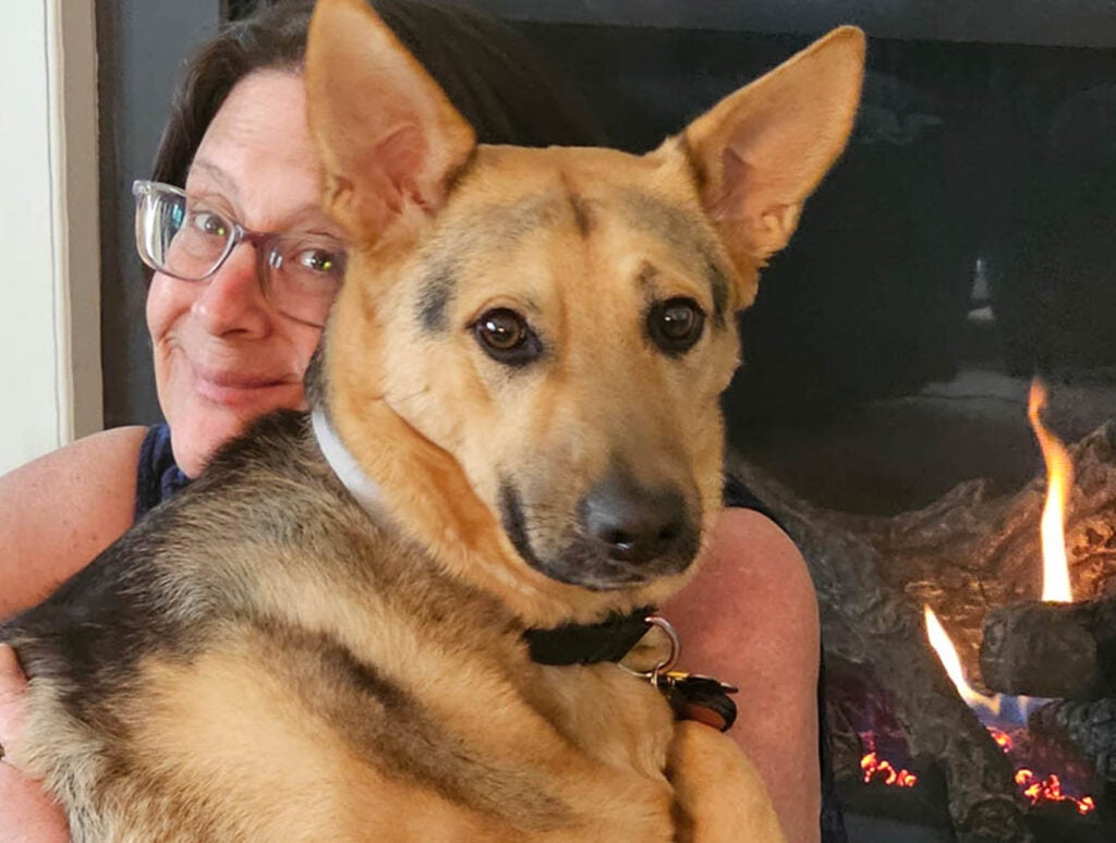 ... Sherwood is a devoted dog lover as well, seen here in a lighter moment at home, with her dog 'Addy.'