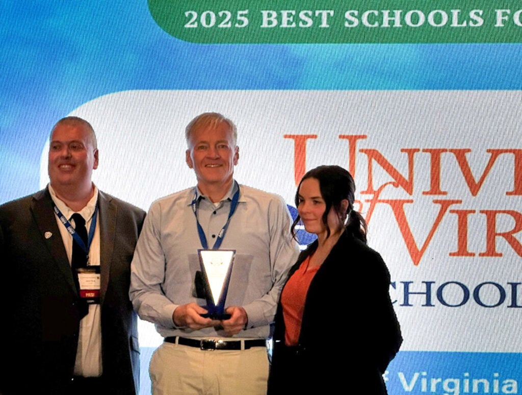 Nisley (center) receives the award at the 2025 AAMN conference in Orlando, FL, with AAMN board president Jason Mott, an associate professor at U of WI Oshkosh College of Nursing.
