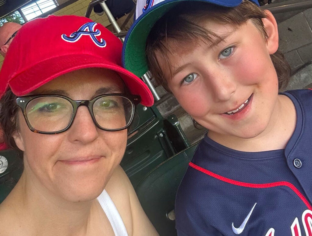 Keim-Malpass and son, Huck, at a baseball game. 'I spend a lot of my free time momming,' says Keim-Malpass.