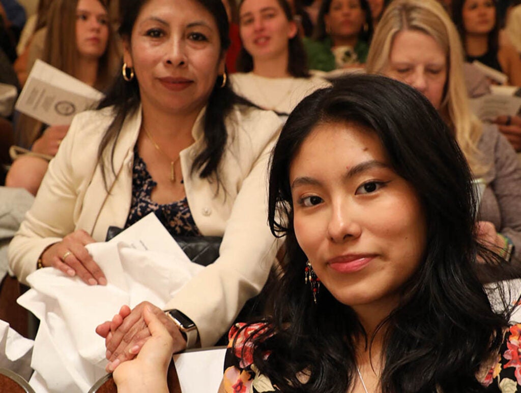 Jurado, seen here with her mom, took part in the 2023 White Coat and Undergraduate Recognition Ceremony in Old Cabel Hall, marking the moment she began caring for human patients during clinicals.