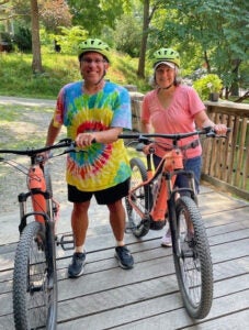 Hope-at-Work_UVA-Health_Walter-and-Stephanie-Oliveira_bicycling