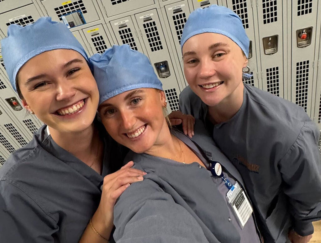 While at UVA, they traded their U of Q plum-colored scrubs for blue student scrubs and grey UVA Health scrubs . . .