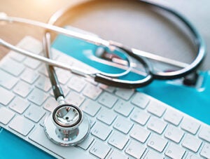 medical stethoscope on keyboard