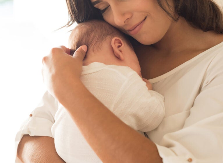 mother holding baby
