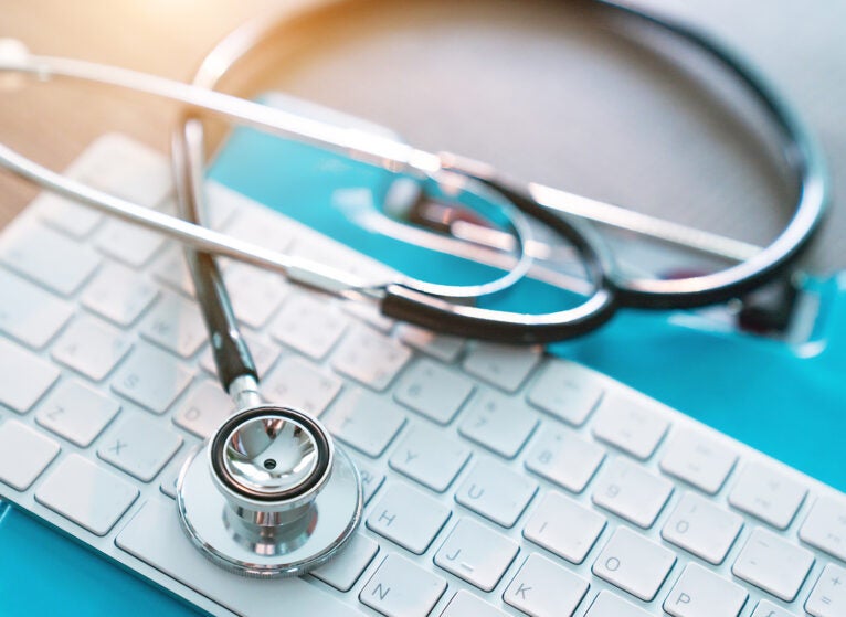 medical stethoscope on keyboard