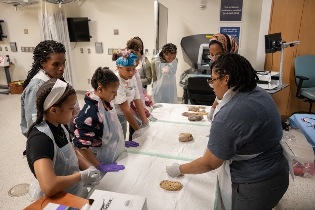 Ansley Scott, MD, MPH and Nouran Sinada, MB, BCh, BAO hosting anatomy organ lab station