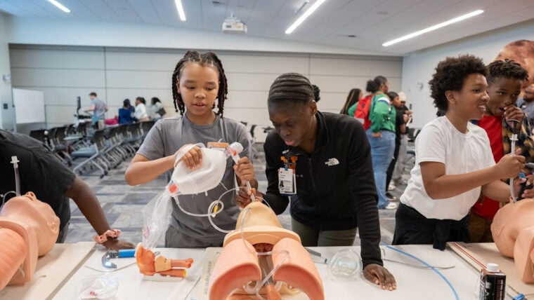 Victoria Bailey, MD walking student through intubation station