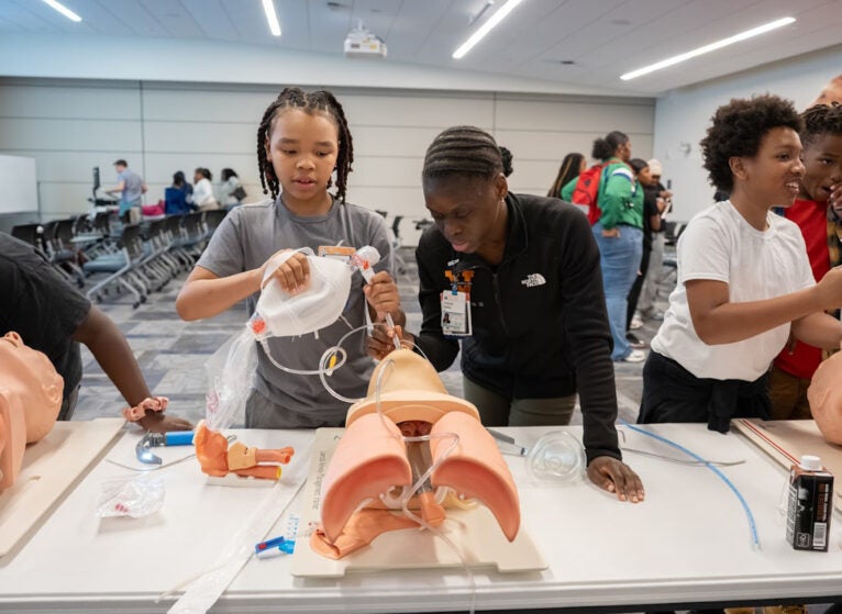 Victoria Bailey, MD walking student through intubation station