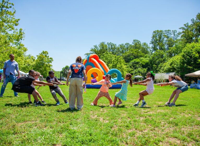 Healthy Streets Healthy People Event Photo. Children playing tug-of-war