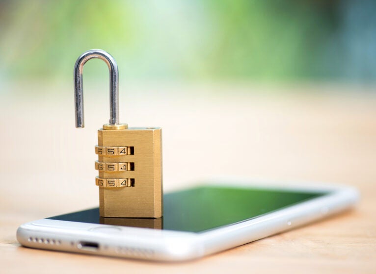 Unsecure mobile phone with open lock.