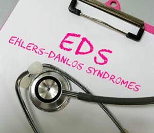 Ehlers-Danlos syndrome term on white background with stethoscope. rare disease.